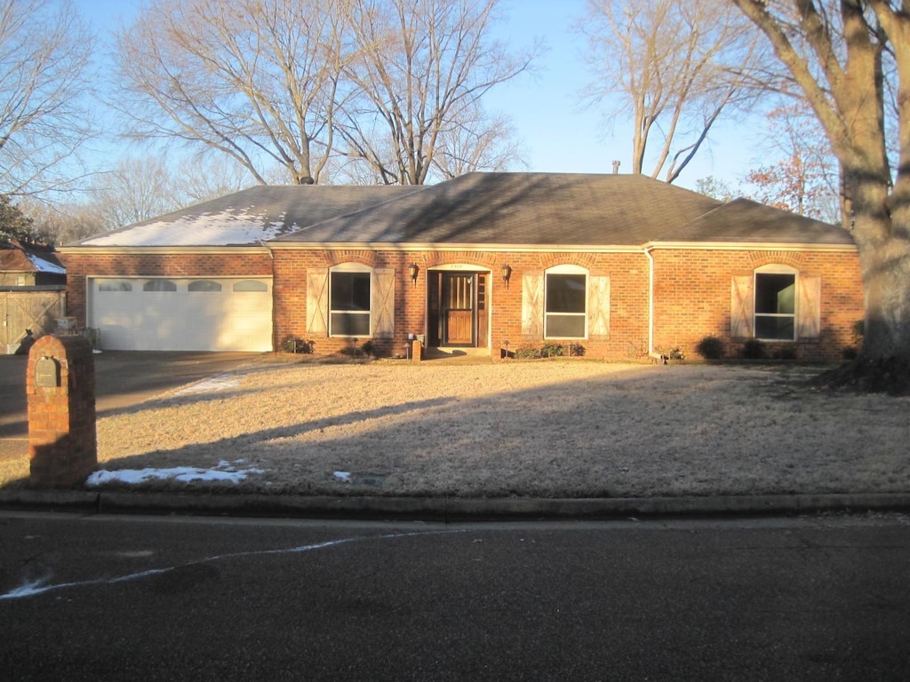 single story home with a garage