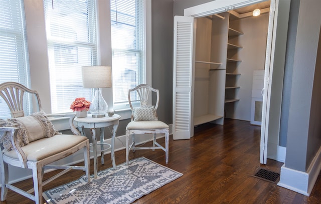 living area with dark hardwood / wood-style flooring