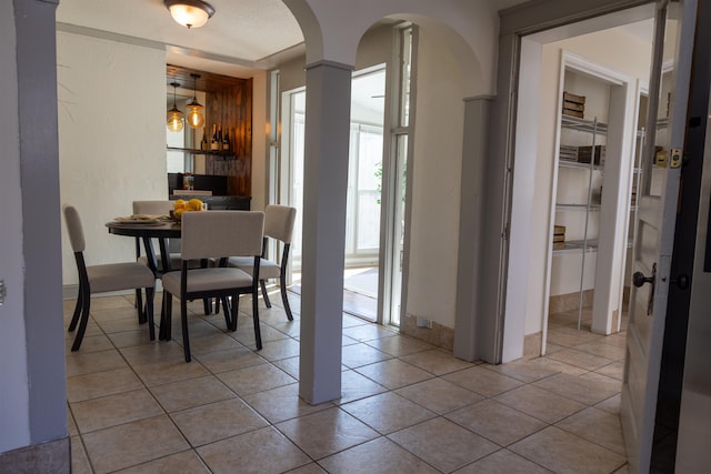 dining space with light tile patterned flooring