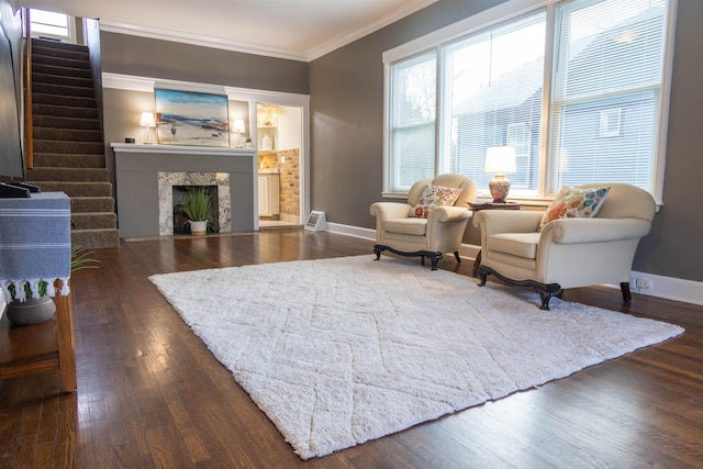 living room featuring dark hardwood / wood-style floors and ornamental molding