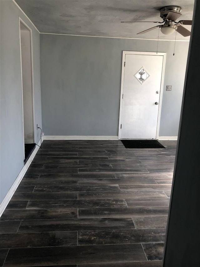 foyer entrance featuring ceiling fan