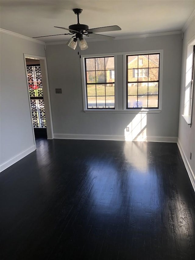 unfurnished room with ceiling fan, dark hardwood / wood-style flooring, and crown molding