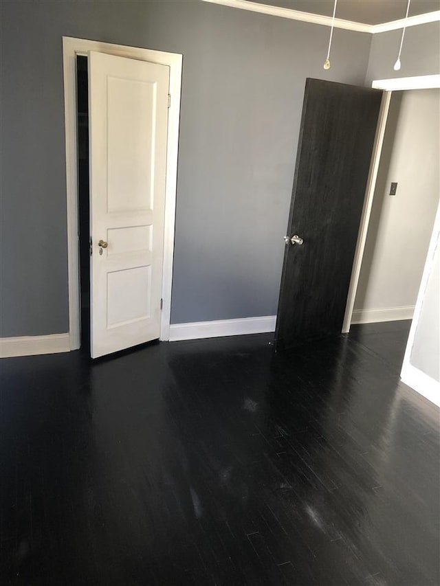 unfurnished room with dark hardwood / wood-style floors