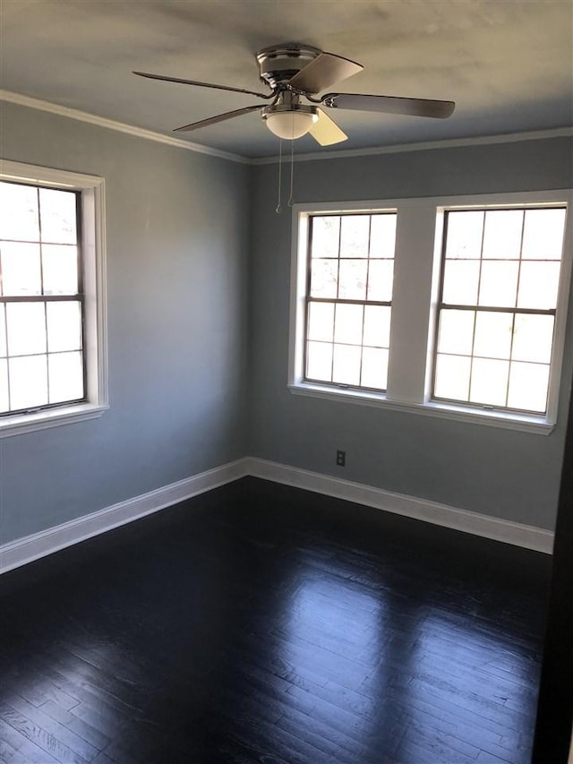 empty room featuring dark hardwood / wood-style flooring, ceiling fan, and ornamental molding