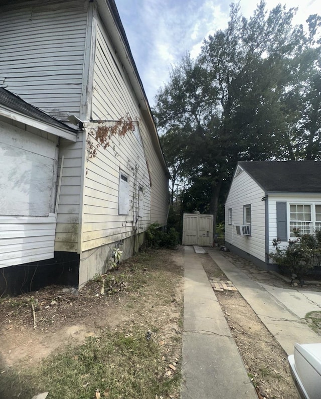 view of side of home featuring cooling unit