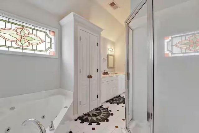 bathroom with shower with separate bathtub, vanity, and plenty of natural light