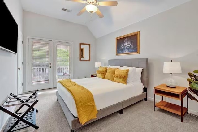 carpeted bedroom with access to outside, vaulted ceiling, and ceiling fan