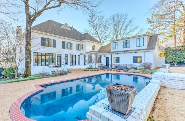 rear view of house featuring a patio