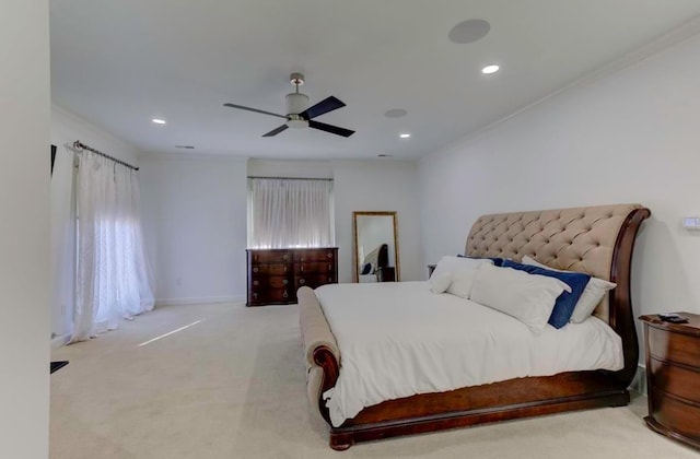 bedroom featuring ceiling fan, crown molding, and light carpet