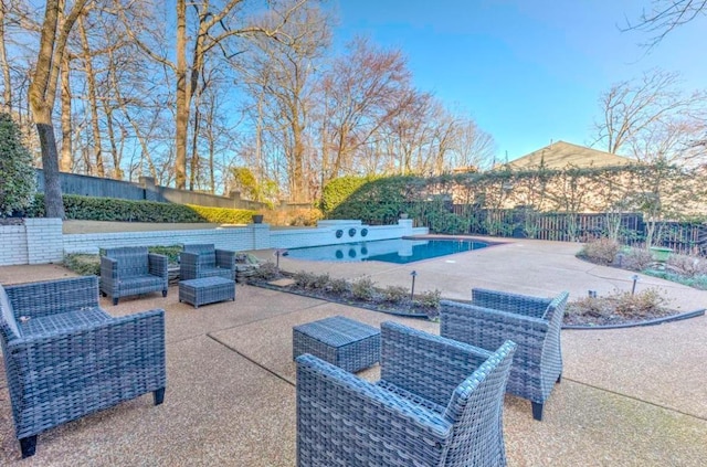 view of patio / terrace with outdoor lounge area and a fenced in pool