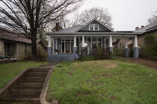 view of front of home featuring a front lawn and a porch