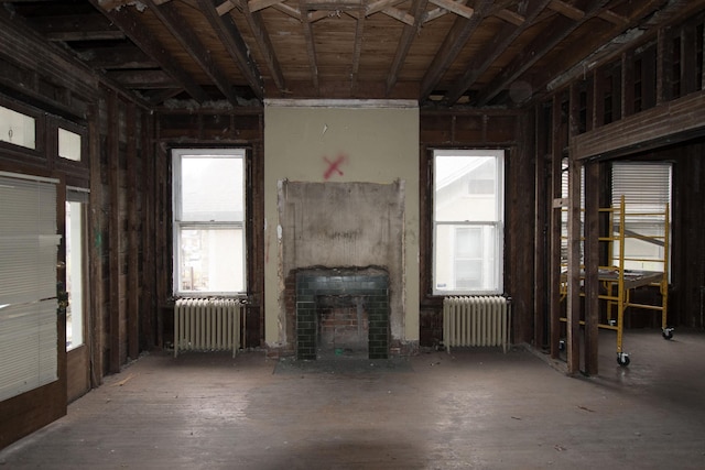 misc room featuring a fireplace and radiator heating unit