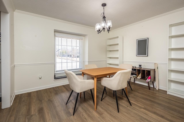 dining area with a textured ceiling, an inviting chandelier, dark hardwood / wood-style flooring, and crown molding