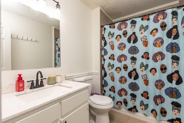 bathroom featuring toilet, vanity, tile patterned flooring, walk in shower, and a textured ceiling