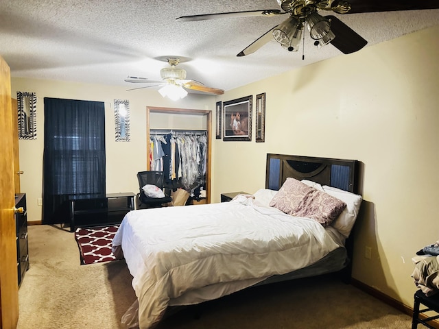 bedroom featuring ceiling fan, carpet floors, a textured ceiling, and a closet