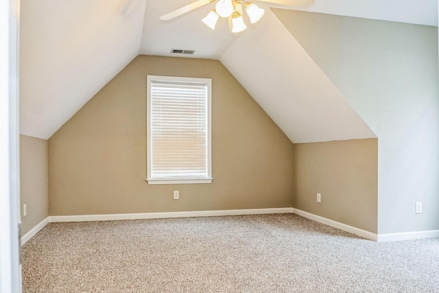 bonus room with carpet, ceiling fan, and vaulted ceiling