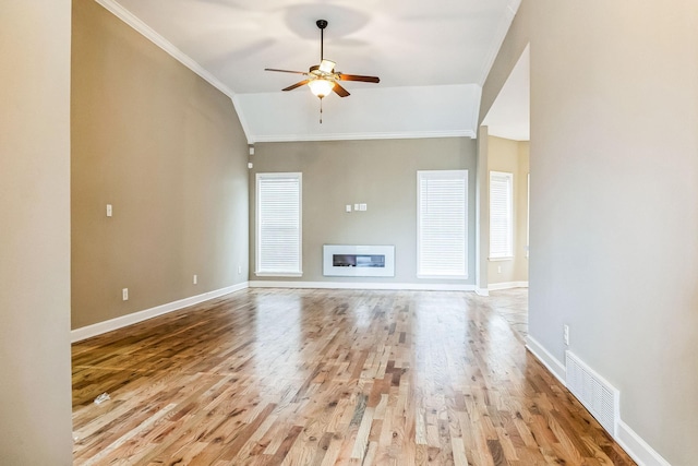 unfurnished living room featuring lofted ceiling, ceiling fan, light wood-type flooring, and ornamental molding