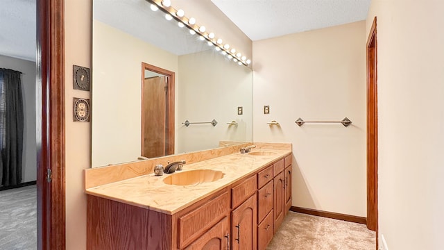 bathroom with vanity and a textured ceiling