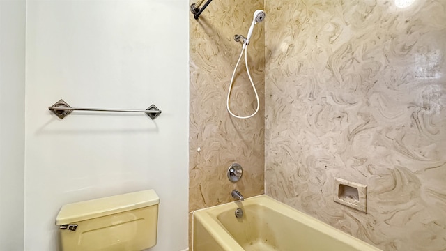 bathroom with bathtub / shower combination and toilet