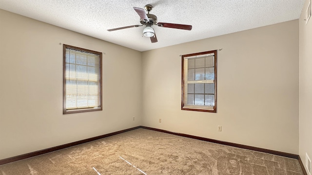 unfurnished room featuring carpet, a textured ceiling, and ceiling fan