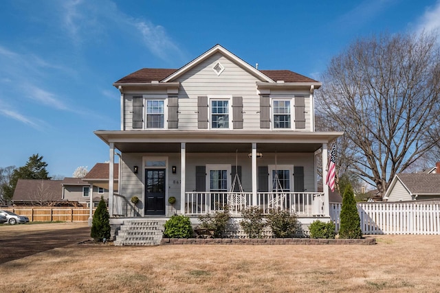 view of front facade with a front lawn and a porch