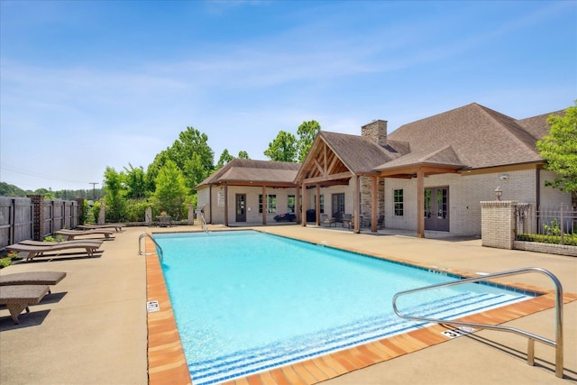 view of swimming pool featuring a patio area