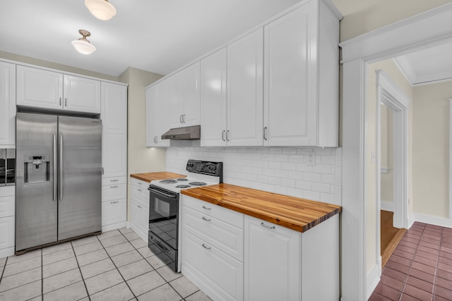 kitchen featuring range with electric cooktop, wood counters, stainless steel built in fridge, white cabinets, and tasteful backsplash