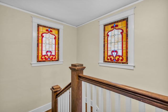 stairway featuring ornamental molding