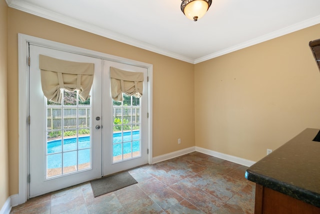 entryway featuring crown molding and french doors