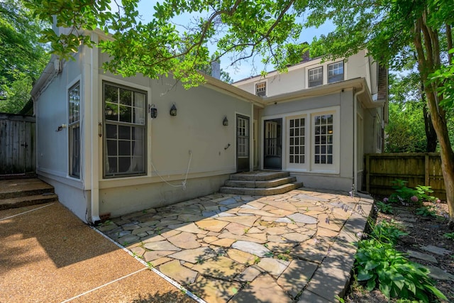 rear view of property featuring a patio area