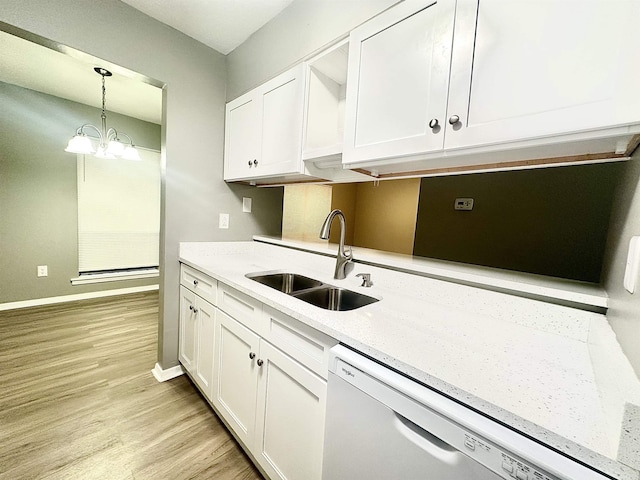 kitchen with sink, white cabinets, dishwasher, and pendant lighting