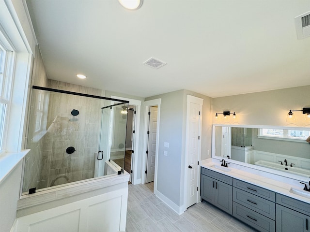 bathroom with vanity and walk in shower