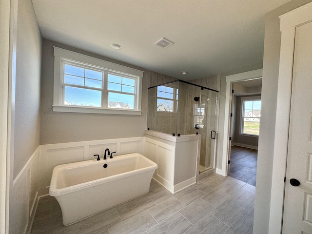 bathroom with independent shower and bath