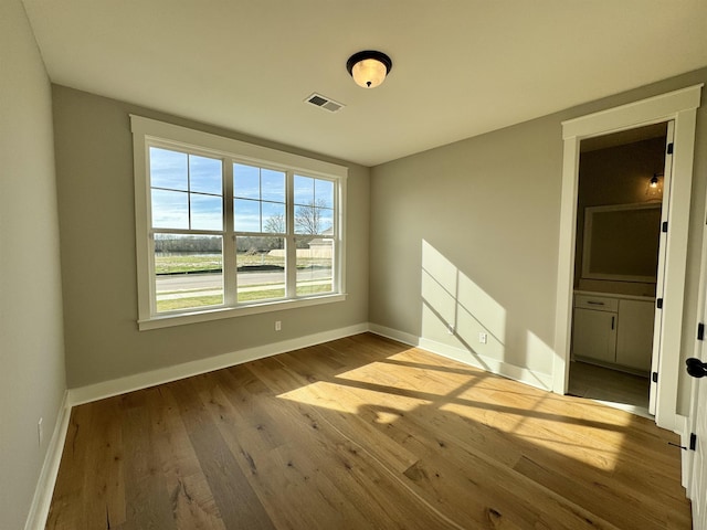 spare room featuring light hardwood / wood-style floors