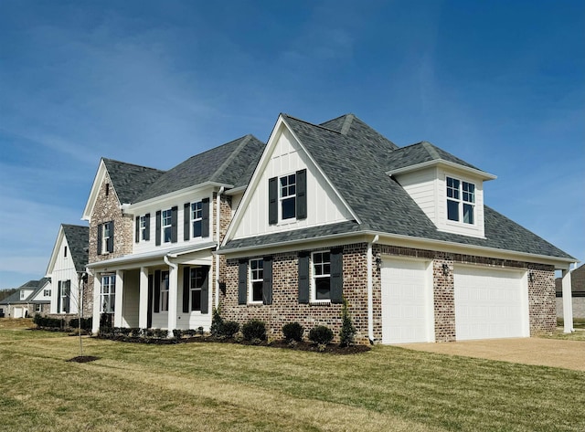 view of front of house featuring a porch, a front yard, and a garage