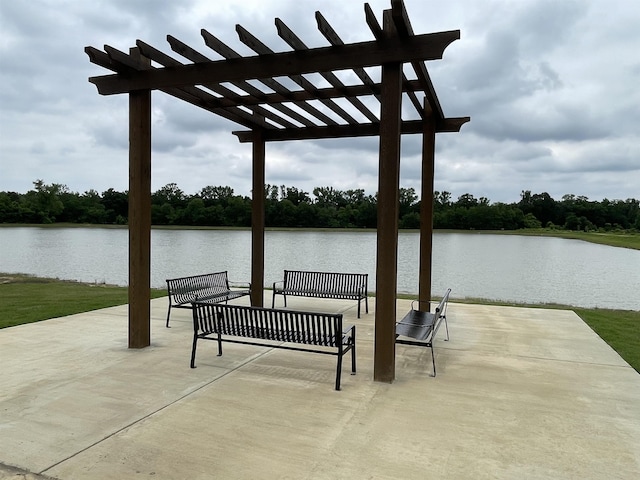 dock area with a patio area, a pergola, and a water view