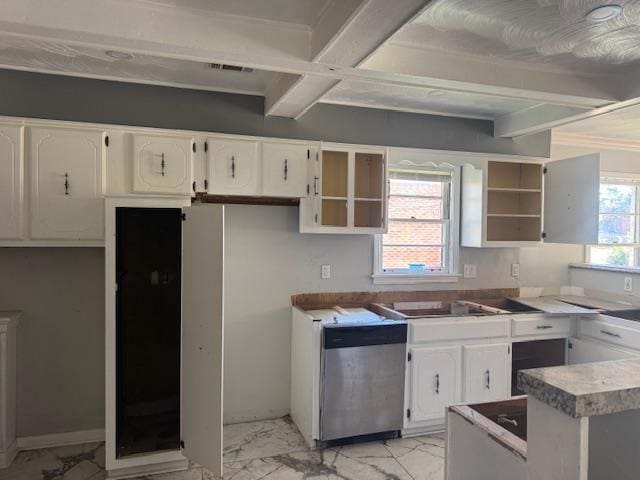 kitchen featuring white cabinetry, stainless steel dishwasher, and plenty of natural light