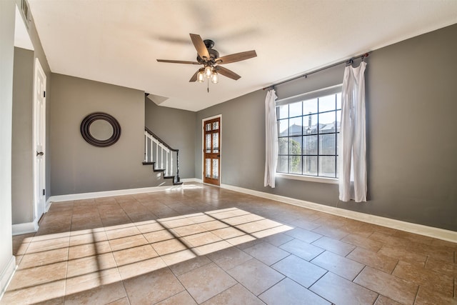 interior space with ceiling fan and light tile patterned floors