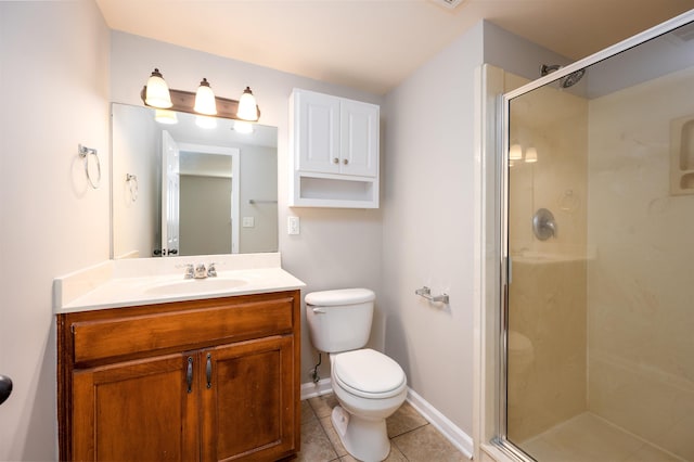 bathroom with vanity, toilet, tile patterned floors, and an enclosed shower