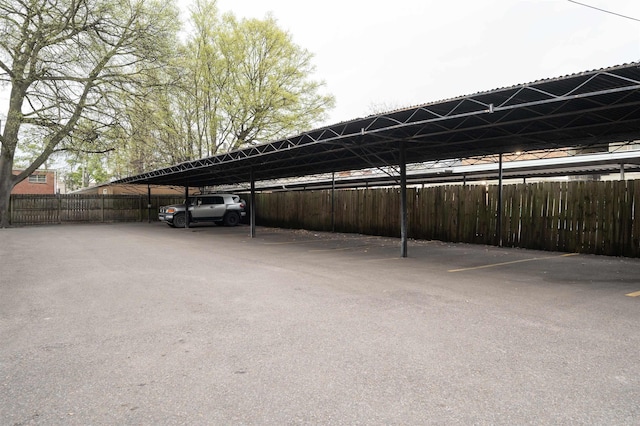 view of parking / parking lot with a carport