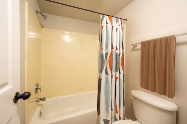 bathroom with toilet and shower / tub combo