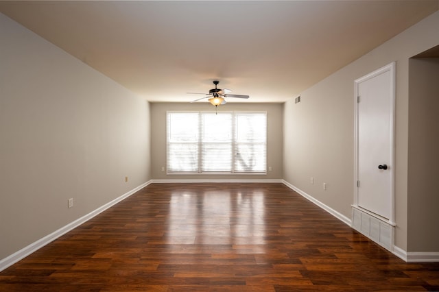 unfurnished room with dark wood-type flooring and ceiling fan