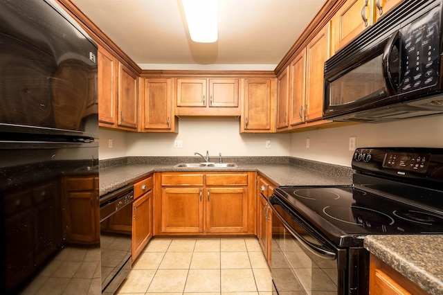 kitchen with black appliances, light tile patterned floors, and sink