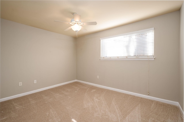 empty room with carpet floors and ceiling fan