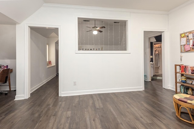 dining room with ornamental molding, ceiling fan, and dark wood-type flooring