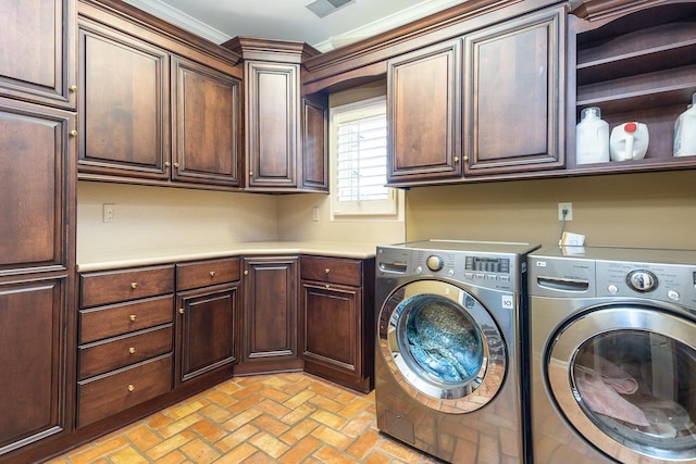 washroom featuring independent washer and dryer, cabinets, and ornamental molding