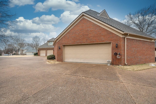 view of side of home with a garage