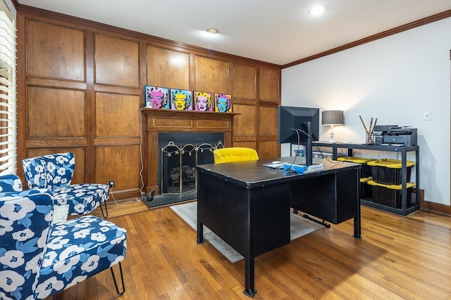 home office featuring ornamental molding and hardwood / wood-style floors