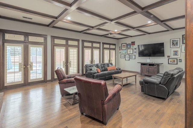 living room featuring coffered ceiling, french doors, and beam ceiling