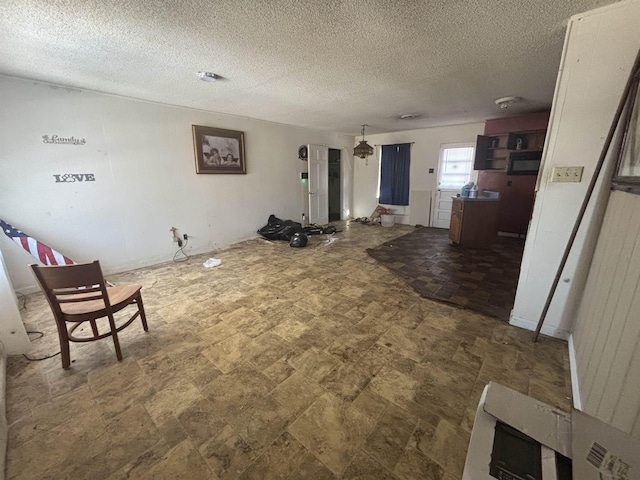 living room featuring a textured ceiling